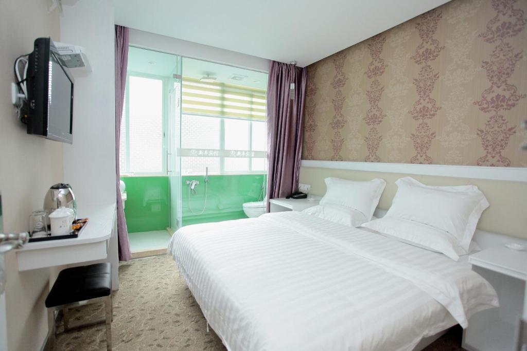 Xinghe Xinfeng Hotel Cantón Habitación foto